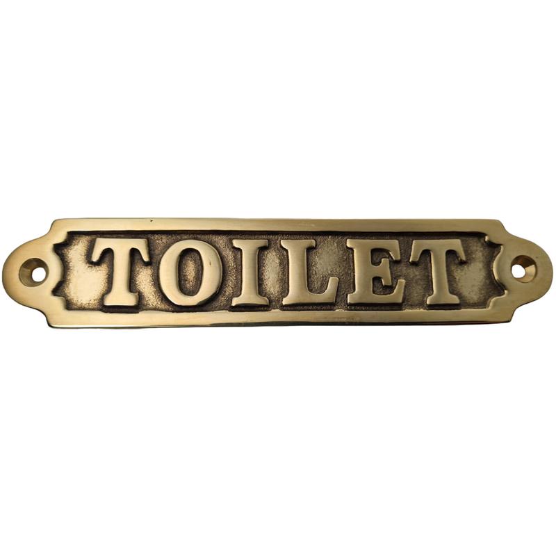 Mässingsskylt . Toilet .